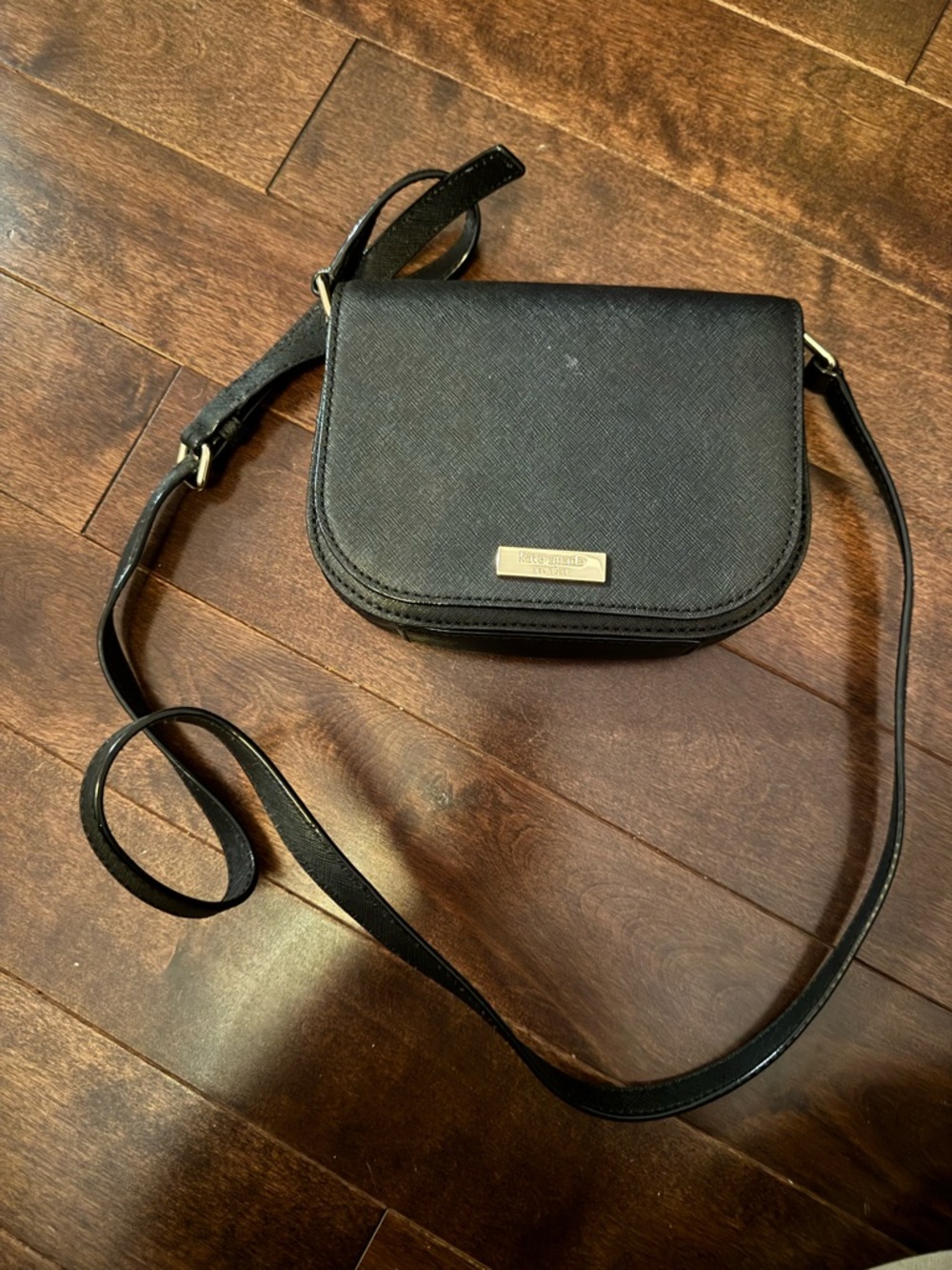 kate spade black crossbody saddle-style bag with gold hardware